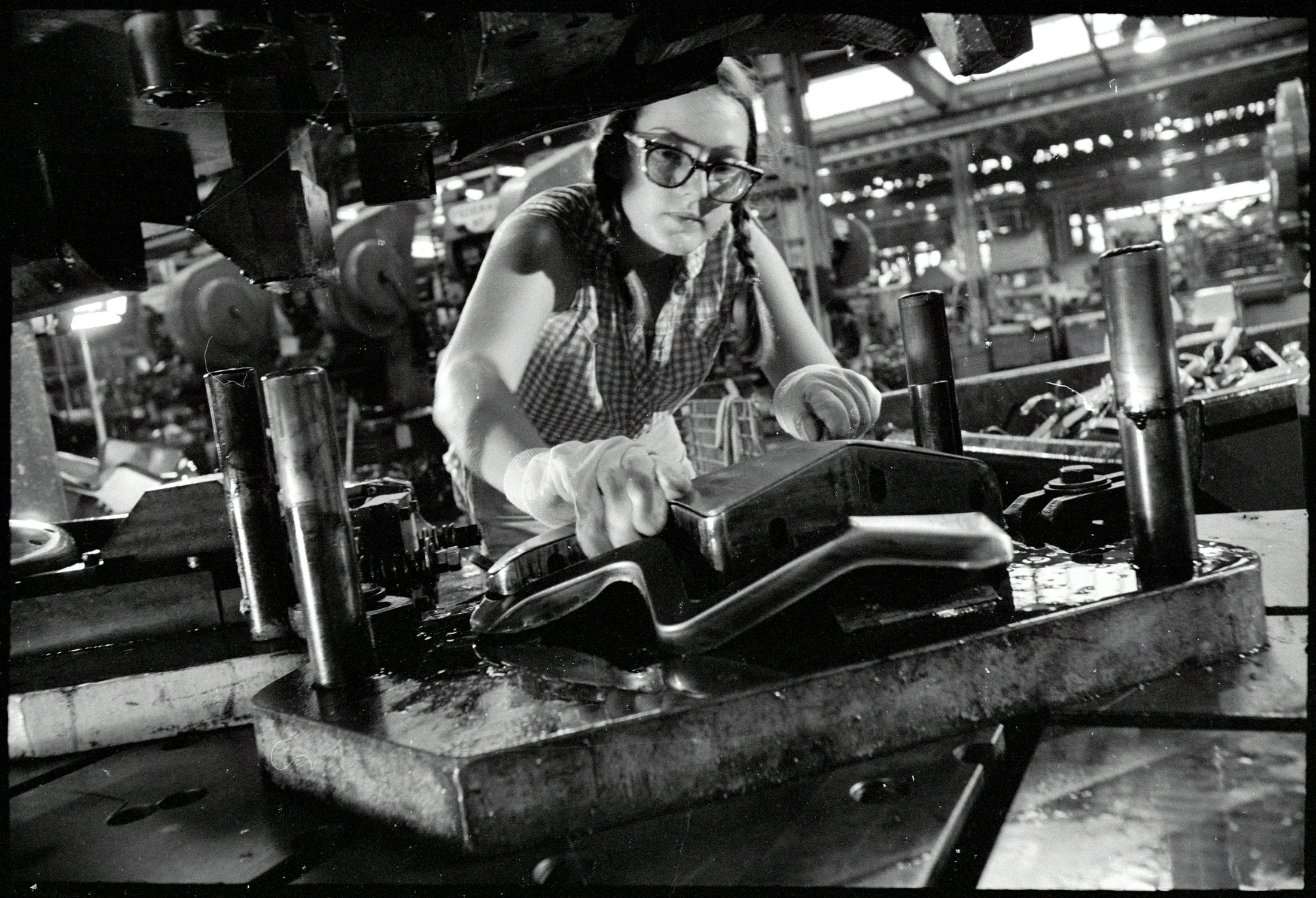 Harley-Davidson factory worker focused on machining