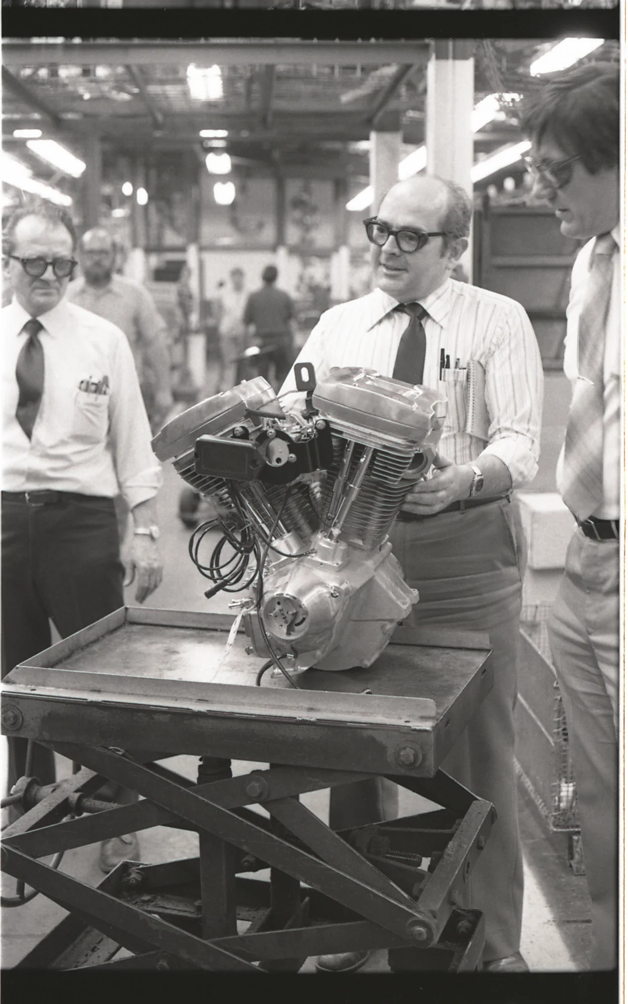 Engineers inspecting a V-Twin on the factory floor