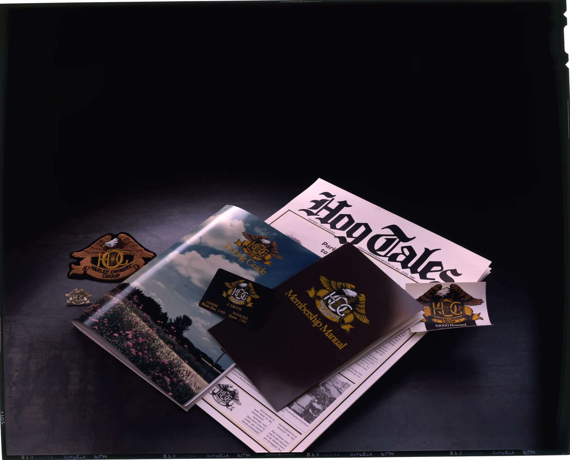 HOG literature and memorabilia, including HOG Tales, the Touring Guide, Membership Manual, patches, cards, etc.