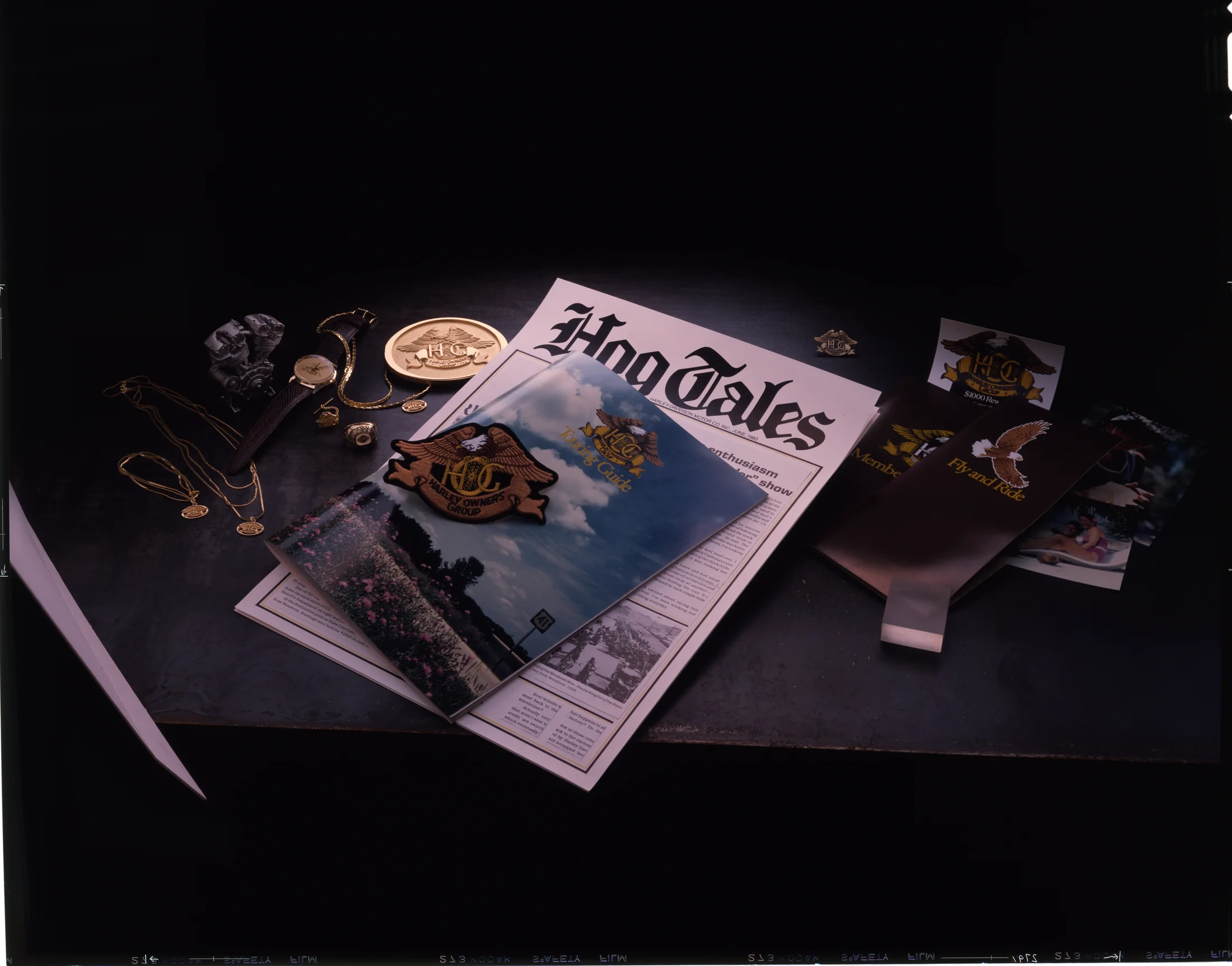HOG literature and memorabilia, including HOG Tales, the Touring Guide, belt buckle, jewelry, etc.